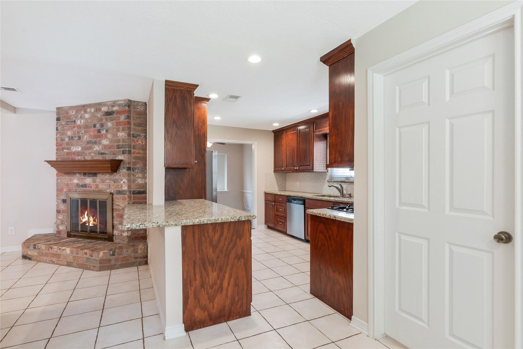 17926 Cypress Spring Drive Spring, TX 77388 - Photo 15 of 34 a kitchen with stainless steel appliances granite countertop a refrigerator and a stove top oven