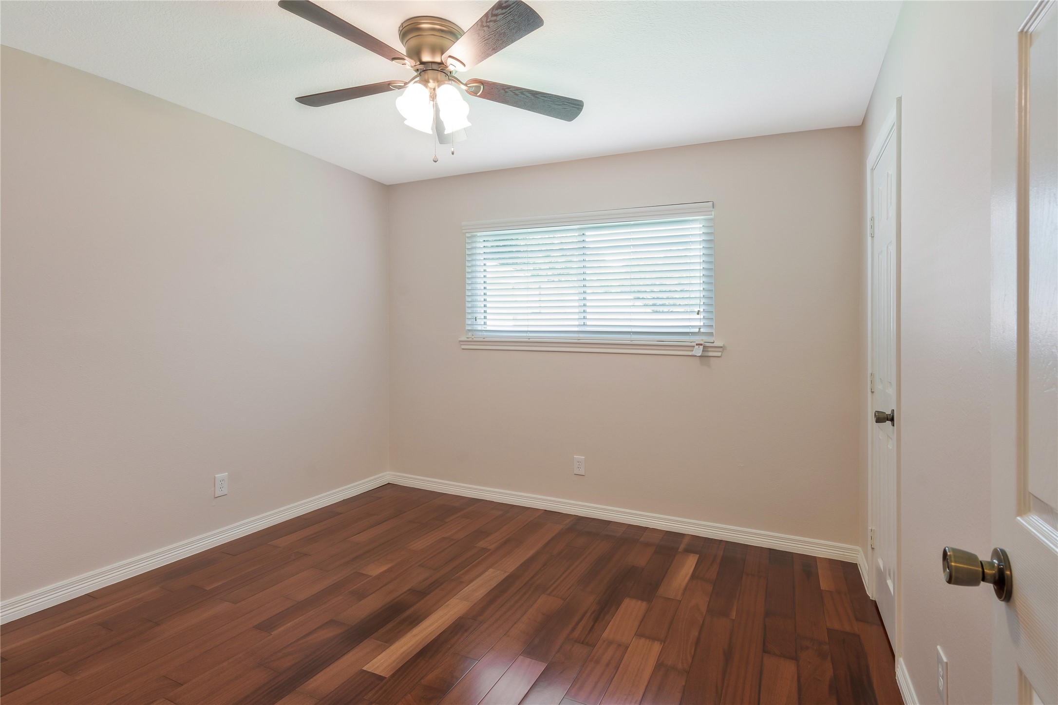 17926 Cypress Spring Drive Spring, TX 77388 - Photo 20 of 34 an empty room with a window and wooden floor