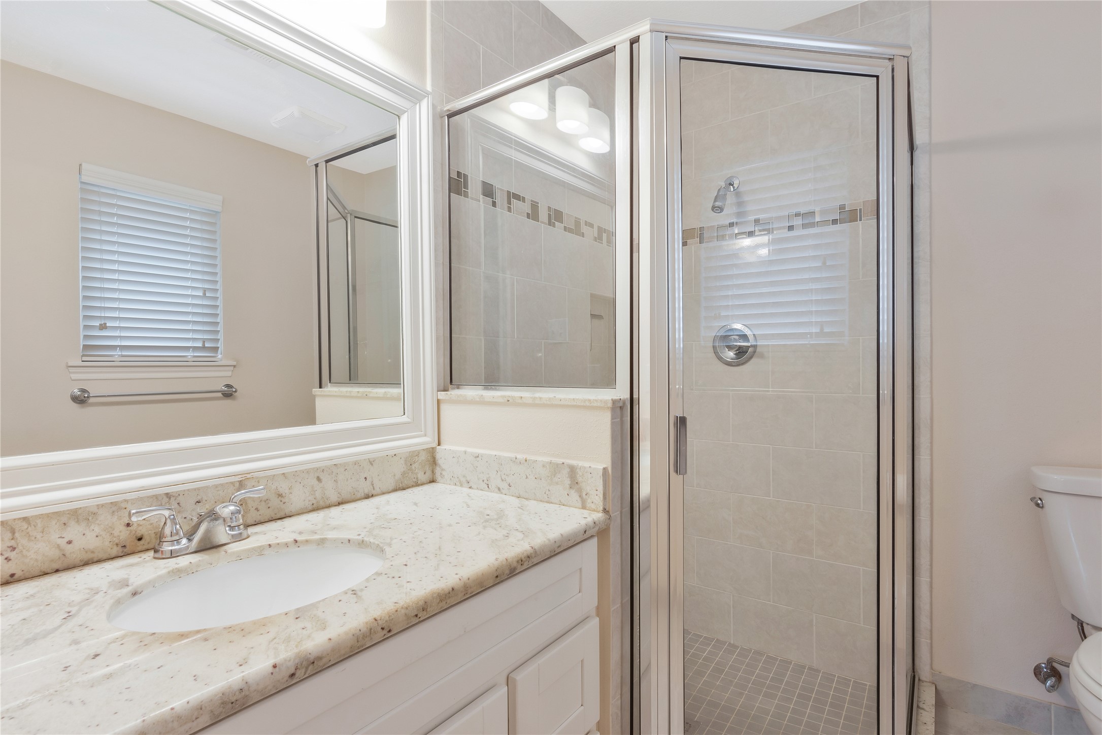 17926 Cypress Spring Drive Spring, TX 77388 - Photo 24 of 34 a bathroom with a granite countertop sink and a mirror