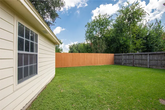 a view of backyard with green space