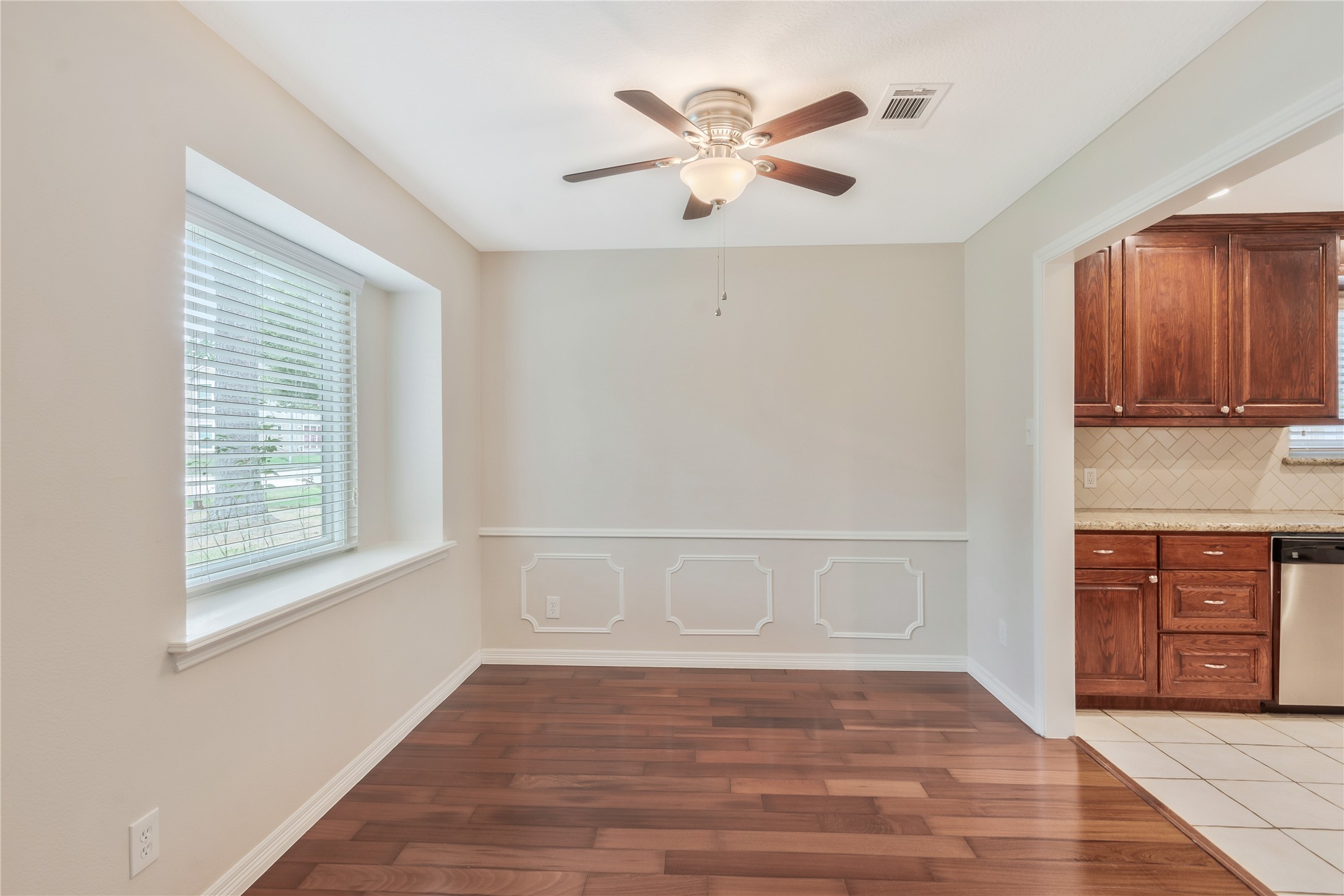 17926 Cypress Spring Drive Spring, TX 77388 - Photo 8 of 34 a view of an empty room with a window and wooden floor