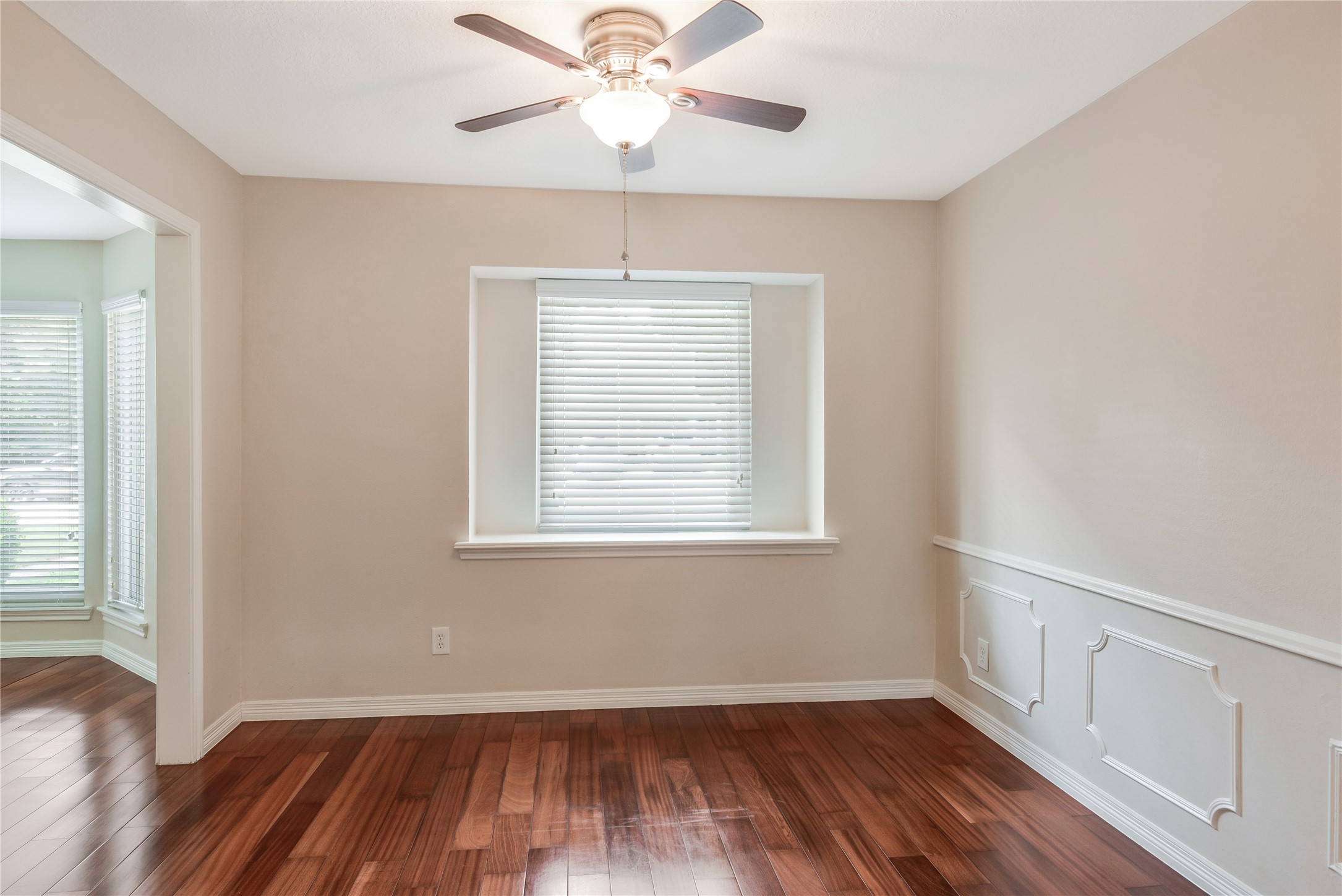 17926 Cypress Spring Drive Spring, TX 77388 - Photo 9 of 34 a view of an empty room with wooden floor and a window
