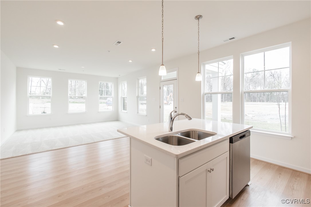 a kitchen with sink and window