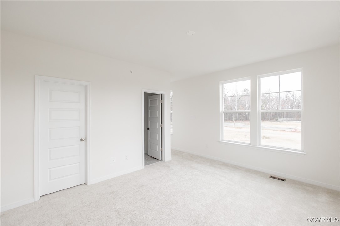 5320 Good Landing Road, Unit 103 Glen Allen, VA 23059 - Photo 12 of 37 an empty room with windows