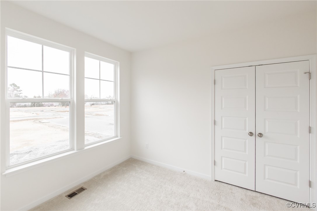 5320 Good Landing Road, Unit 103 Glen Allen, VA 23059 - Photo 16 of 37 an empty room with a window