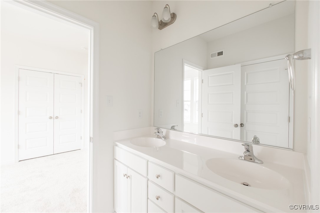 5320 Good Landing Road, Unit 103 Glen Allen, VA 23059 - Photo 17 of 37 a bathroom with a sink and a mirror