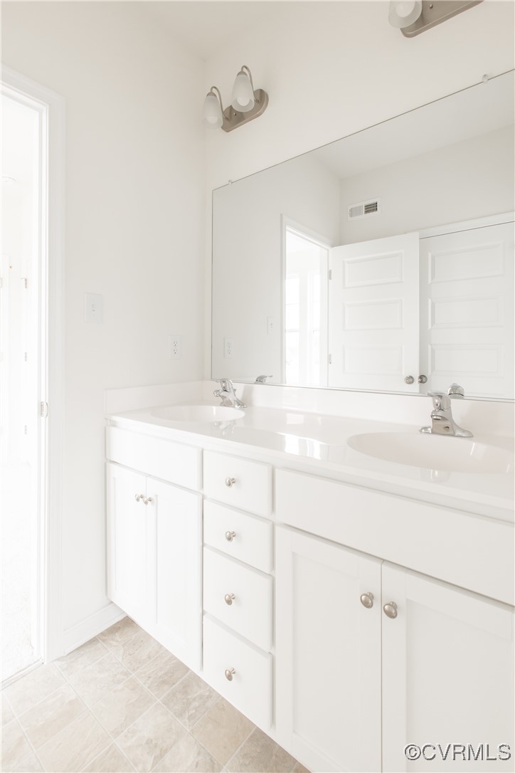 5320 Good Landing Road, Unit 103 Glen Allen, VA 23059 - Photo 18 of 37 a bathroom with a sink vanity and mirror