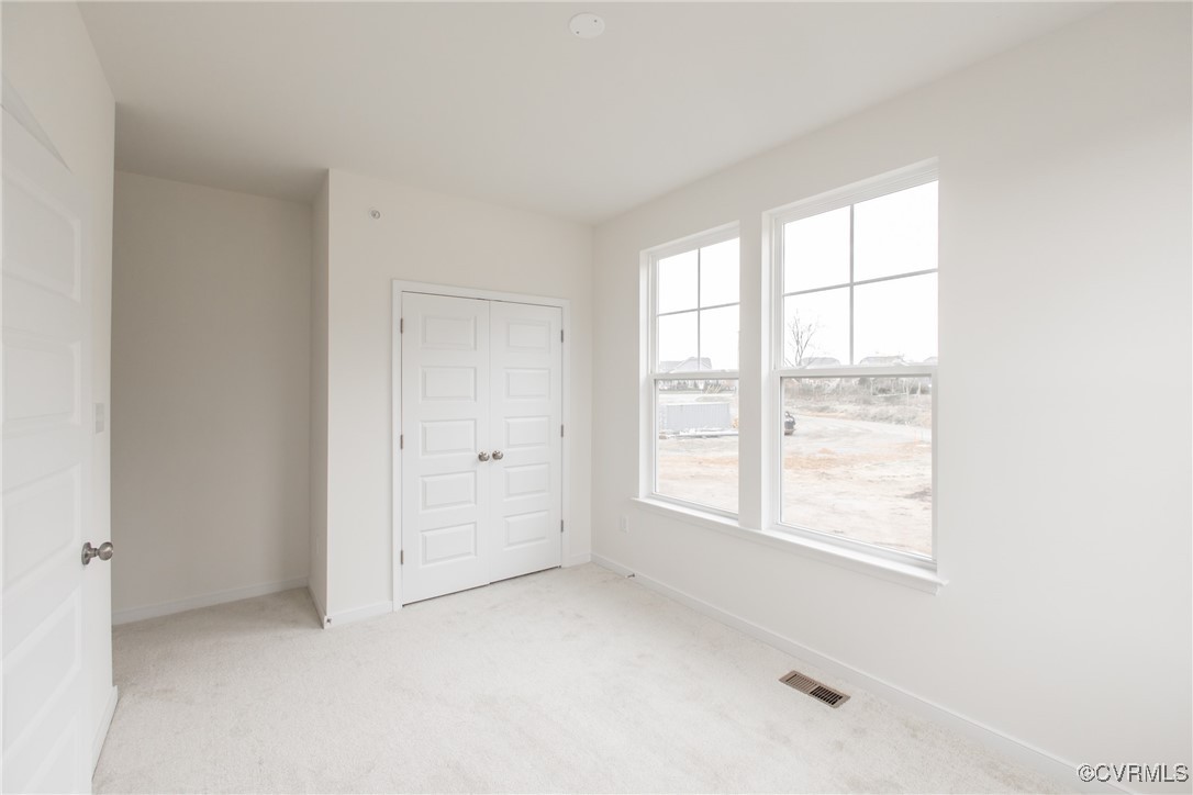 5320 Good Landing Road, Unit 103 Glen Allen, VA 23059 - Photo 21 of 37 a view of an empty room with a window