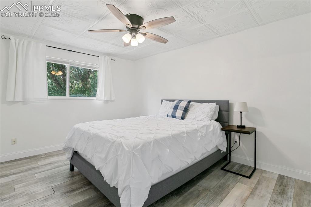 2960 Rio Vista Drive Colorado Springs, CO 80917 - Photo 19 of 32 a large bed sitting in a bedroom next to a window