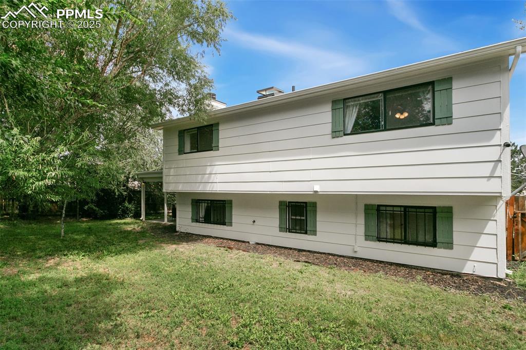 2960 Rio Vista Drive Colorado Springs, CO 80917 - Photo 28 of 32 a view of a house with a yard
