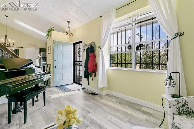 a view of a livingroom with furniture and a window