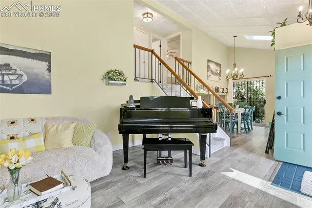 a living room with furniture and a stairs