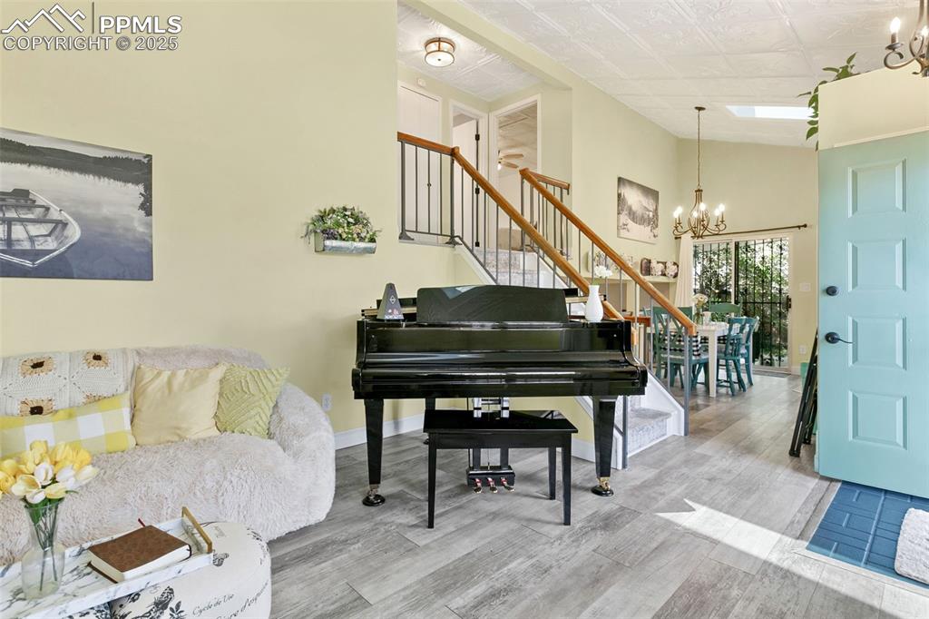 2960 Rio Vista Drive Colorado Springs, CO 80917 - Photo 7 of 32 a living room with furniture and a stairs
