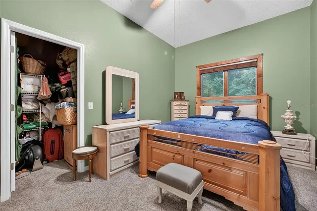 a bedroom with furniture and a window