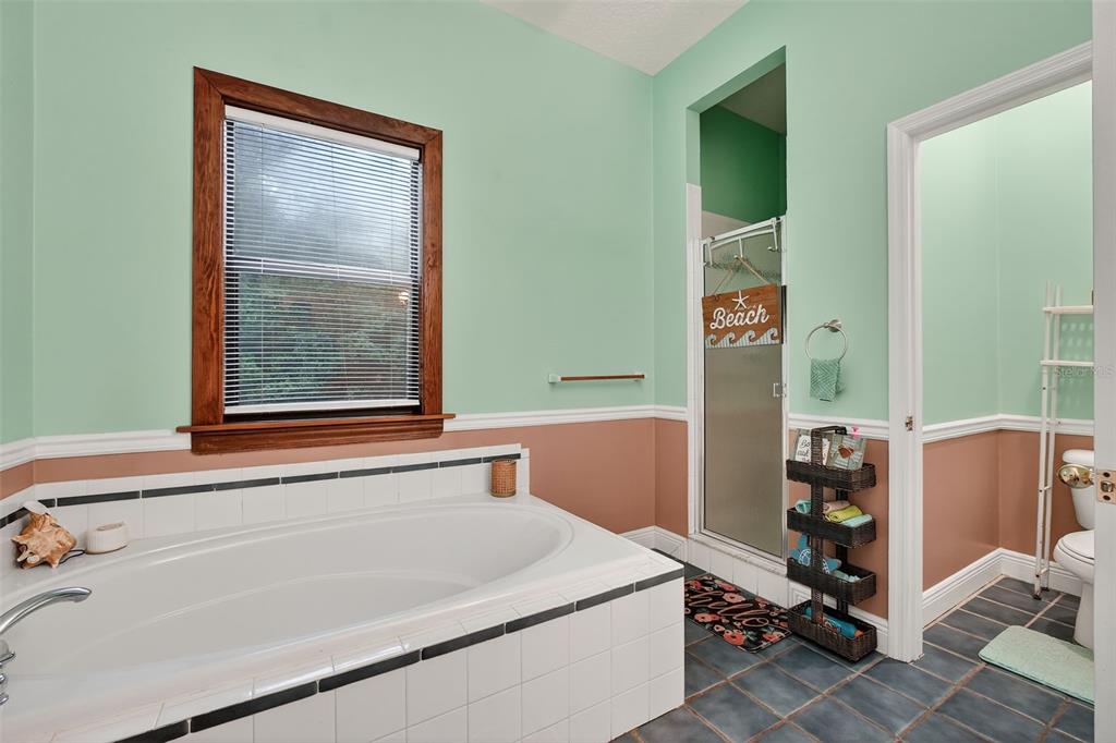 2836 Shenandoah Road DeLand, FL 32720 - Photo 15 of 46 a bathroom with a bathtub and shower