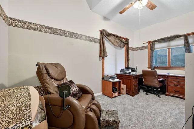 a living room with furniture a window and a chandelier