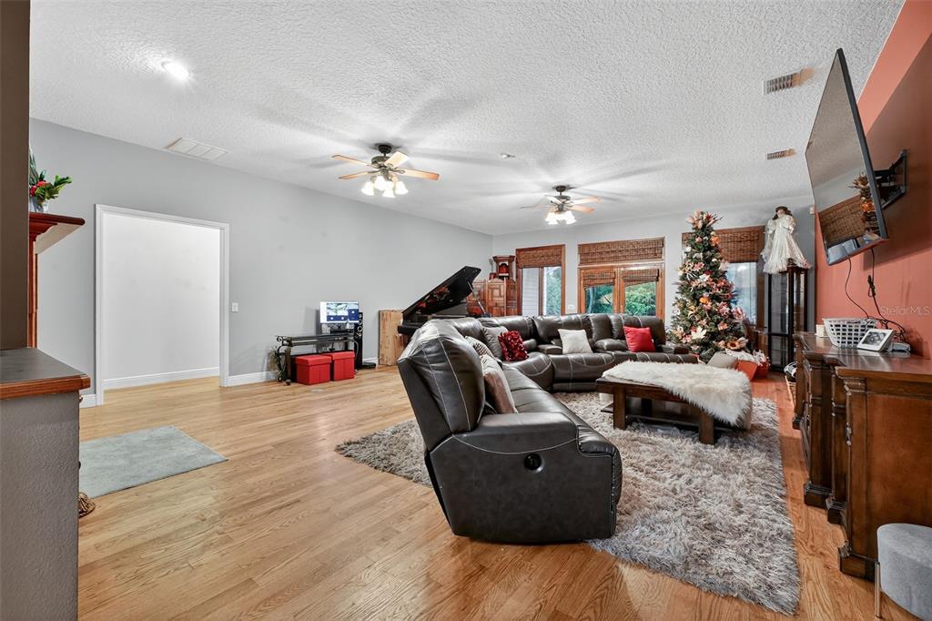 2836 Shenandoah Road DeLand, FL 32720 - Photo 22 of 46 a living room with furniture and a flat screen tv