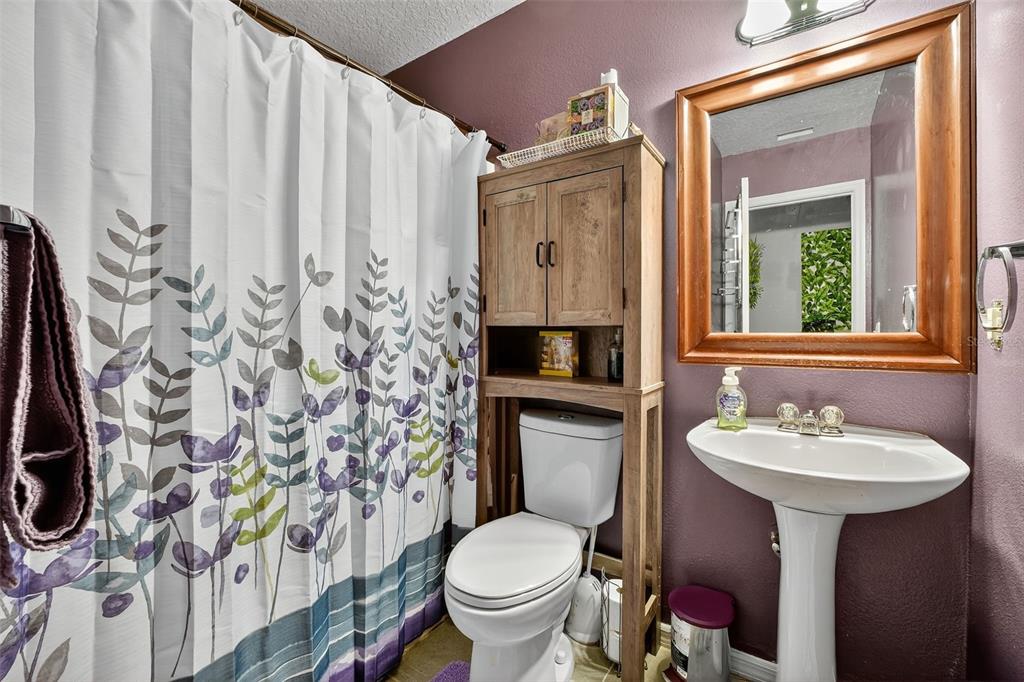 2836 Shenandoah Road DeLand, FL 32720 - Photo 37 of 46 a bathroom with a sink toilet and mirror