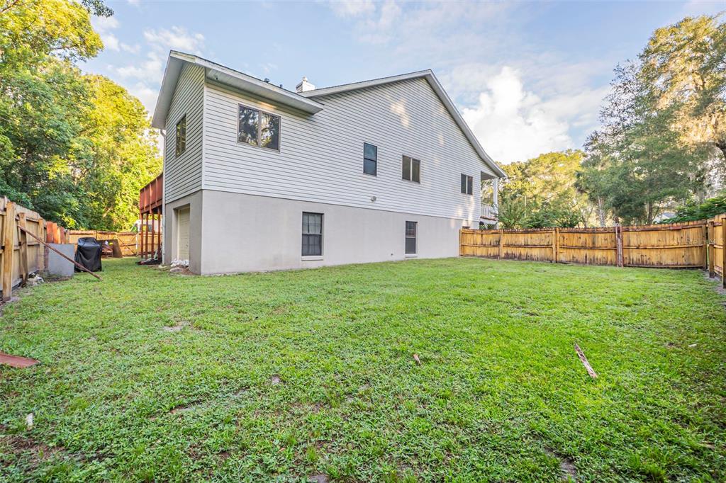 2836 Shenandoah Road DeLand, FL 32720 - Photo 40 of 46 a view of a house with backyard and a tree