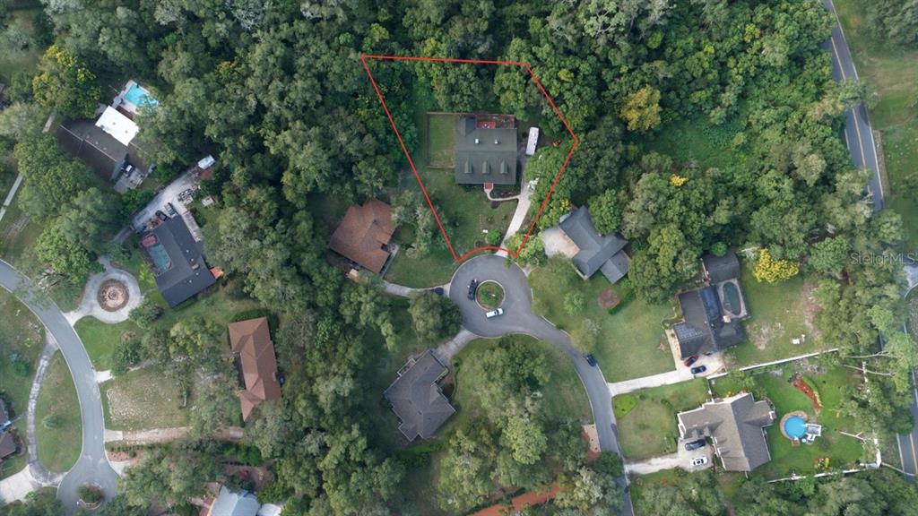 2836 Shenandoah Road DeLand, FL 32720 - Photo 44 of 46 an aerial view of a residential houses with outdoor space and street view