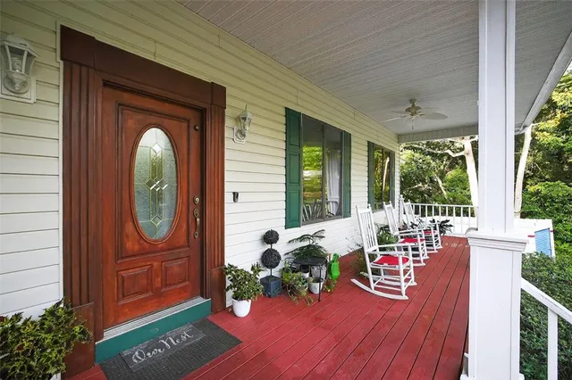 a view of a house with porch and wooden floor