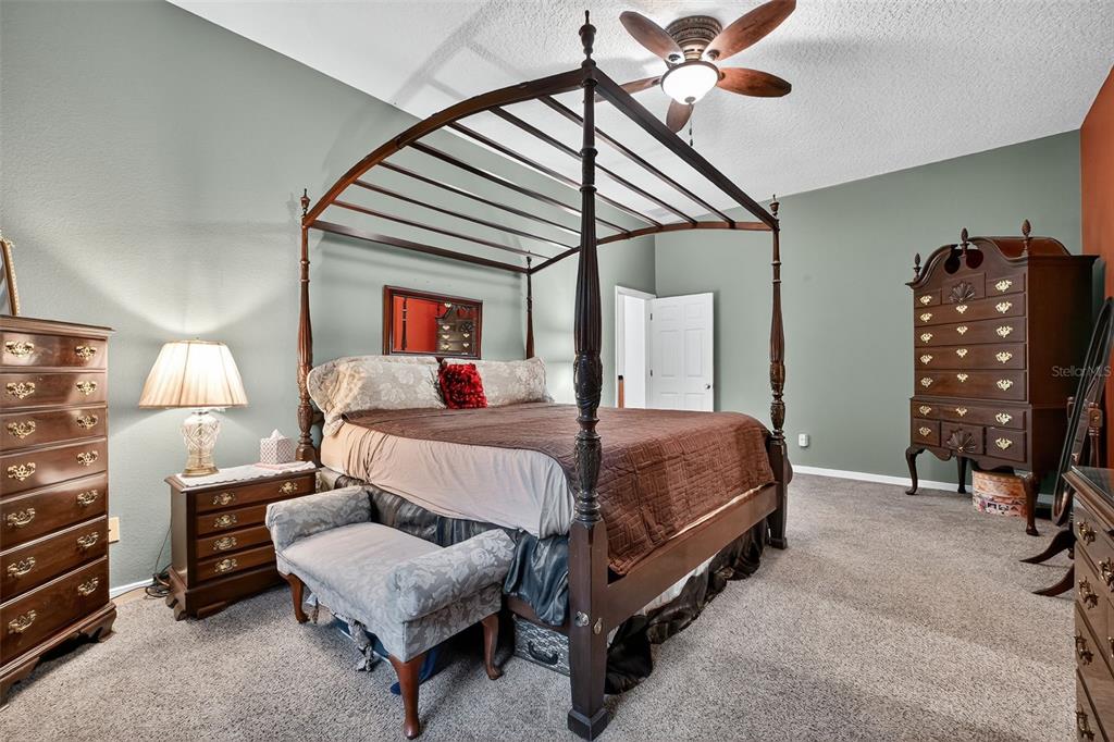 2836 Shenandoah Road DeLand, FL 32720 - Photo 8 of 46 a bedroom with a bed a couch and dresser