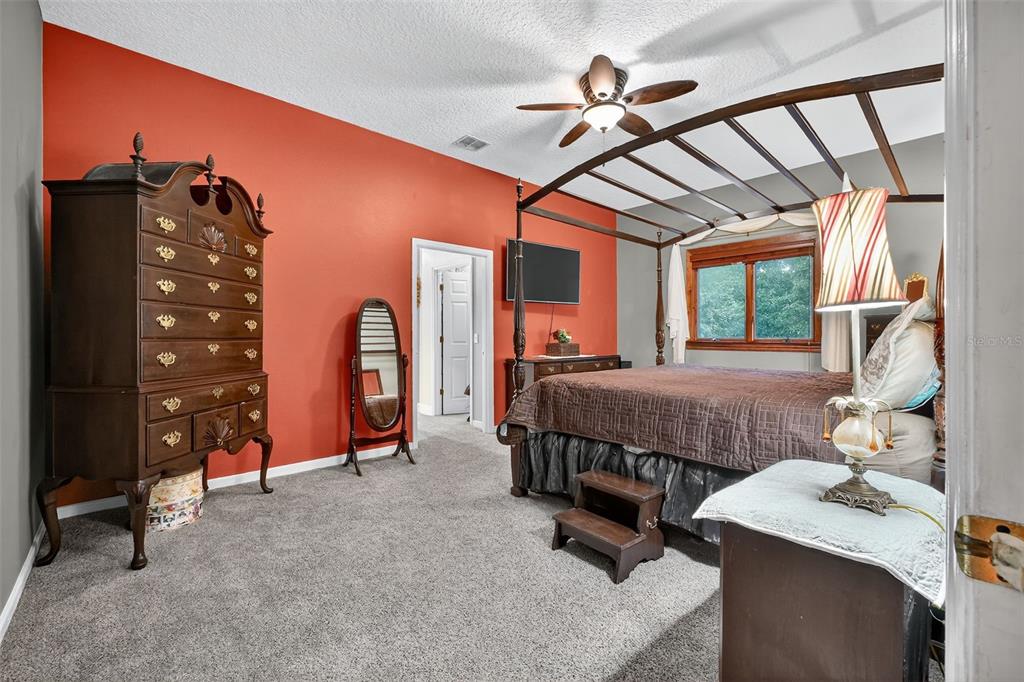 2836 Shenandoah Road DeLand, FL 32720 - Photo 9 of 46 a bedroom with a bed dresser and a window