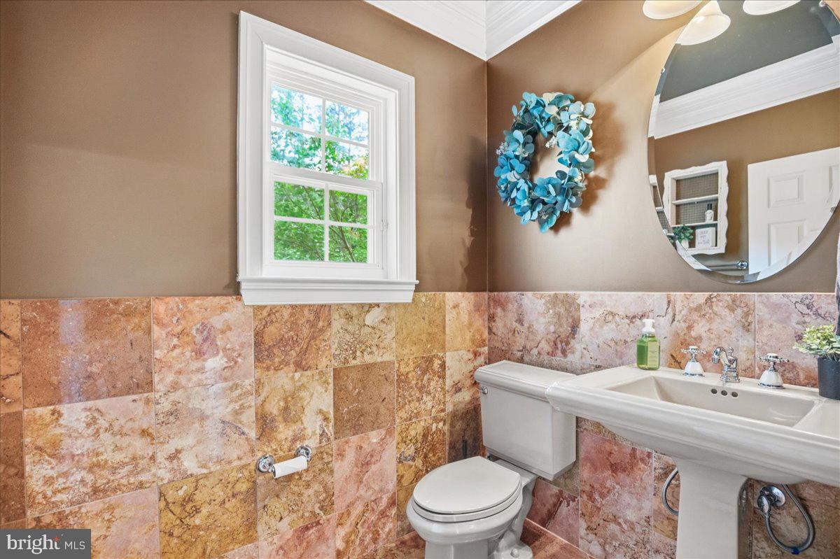 4100 Hidden Creek Road Port Republic, MD 20676 - Photo 26 of 99 Half bath with marble wall accent