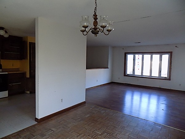 280 Ellendale Circle Springfield, MA 01128 - Photo 8 of 26 wooden floor in an empty room with a window