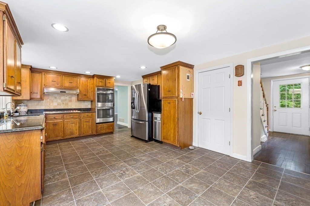 2 King George Drive Boxford, MA 01921 - Photo 13 of 41 a view of a kitchen with a sink and a refrigerator