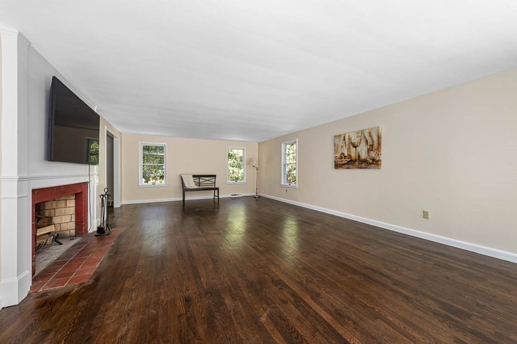 2 King George Drive Boxford, MA 01921 - Photo 15 of 41 a view of a livingroom with furniture a fireplace and wooden floor