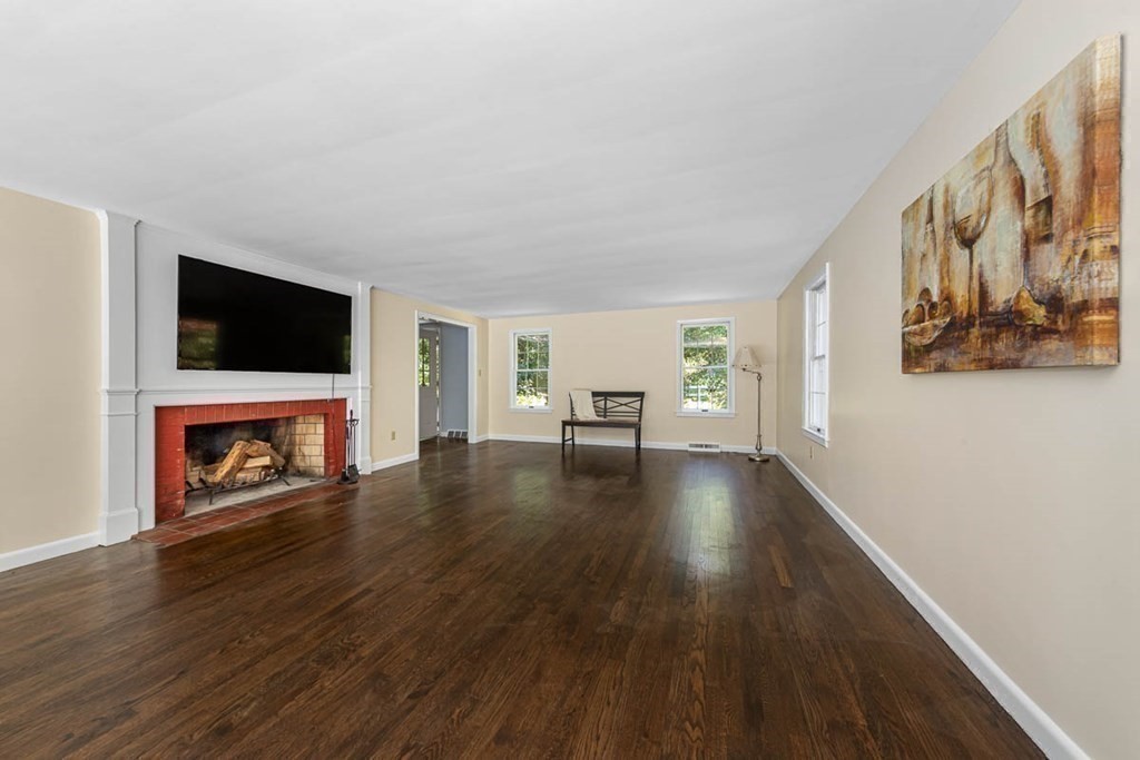 2 King George Drive Boxford, MA 01921 - Photo 16 of 41 a view of a livingroom with furniture wooden floor and window