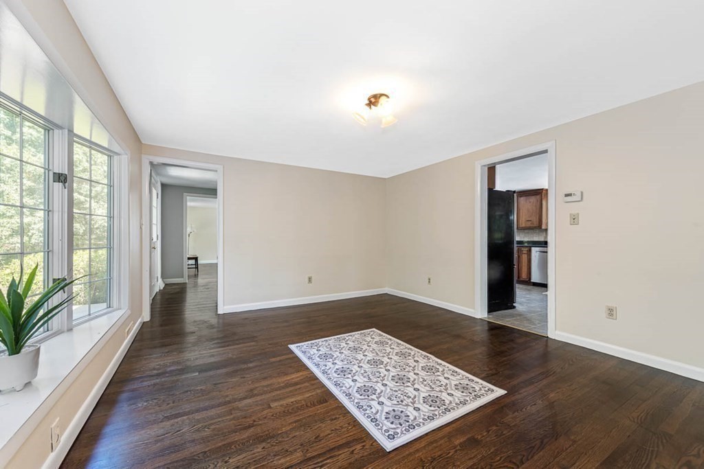2 King George Drive Boxford, MA 01921 - Photo 21 of 41 an empty room with wooden floor and windows