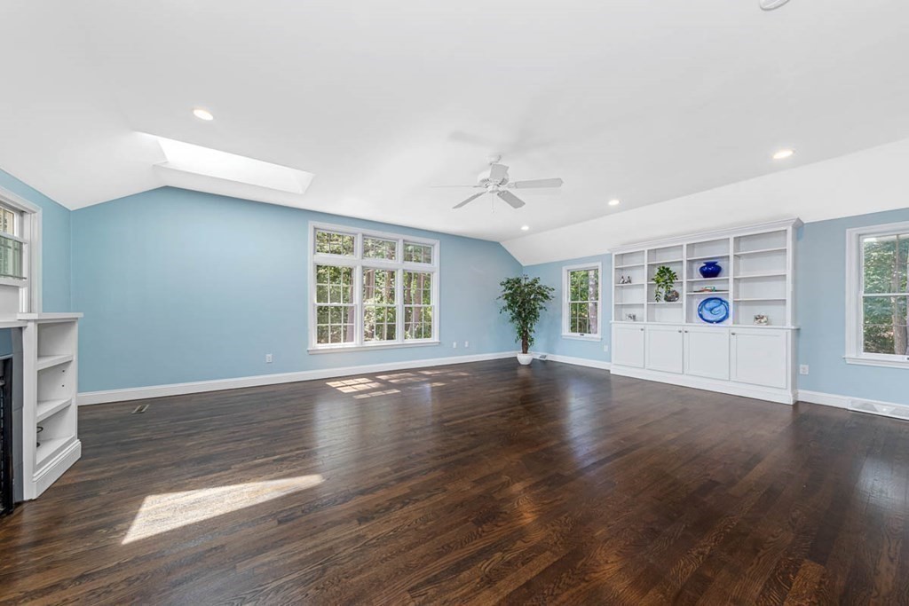2 King George Drive Boxford, MA 01921 - Photo 25 of 41 a view of an empty room with wooden floor and a window
