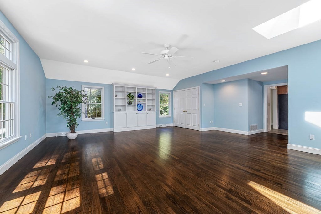 2 King George Drive Boxford, MA 01921 - Photo 26 of 41 a view of an empty room with window and wooden floor