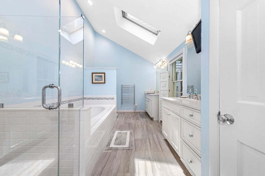 2 King George Drive Boxford, MA 01921 - Photo 32 of 41 a spacious bathroom with a granite countertop sink a mirror and shower