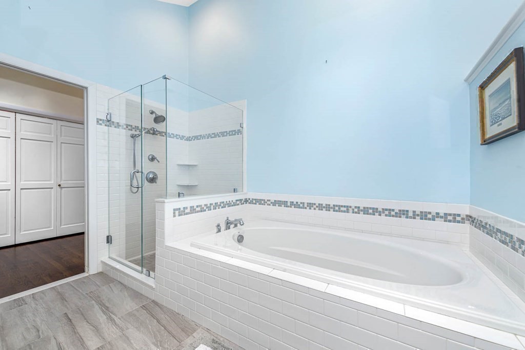 2 King George Drive Boxford, MA 01921 - Photo 33 of 41 a bathroom with a bathtub and a shower