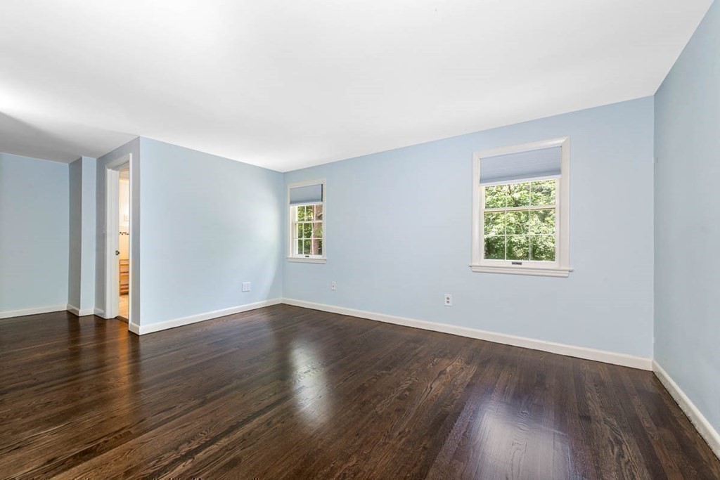 2 King George Drive Boxford, MA 01921 - Photo 35 of 41 an empty room with wooden floor and windows