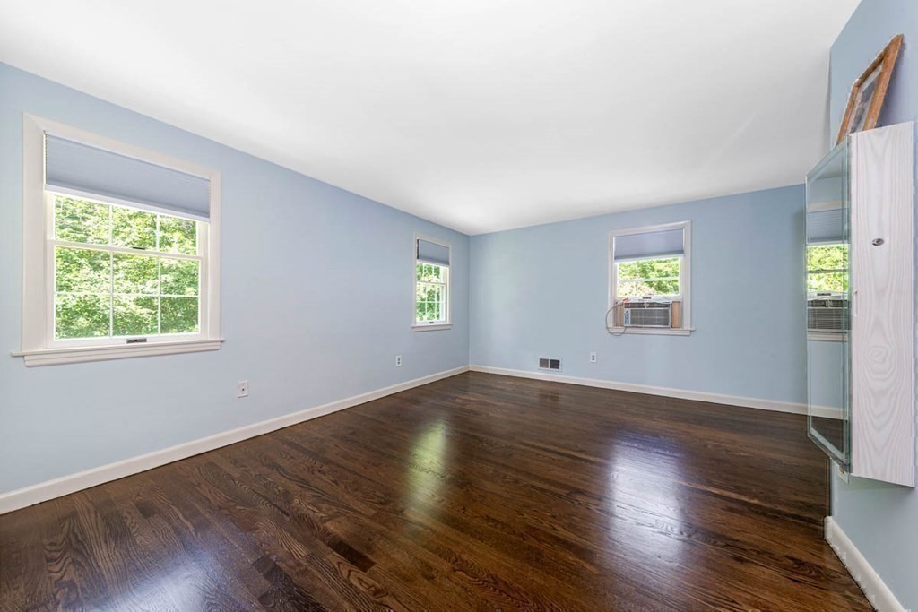 2 King George Drive Boxford, MA 01921 - Photo 36 of 41 an empty room with wooden floor and windows
