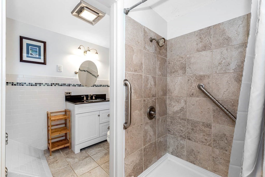 2 King George Drive Boxford, MA 01921 - Photo 37 of 41 a bathroom with a shower sink and cabinets