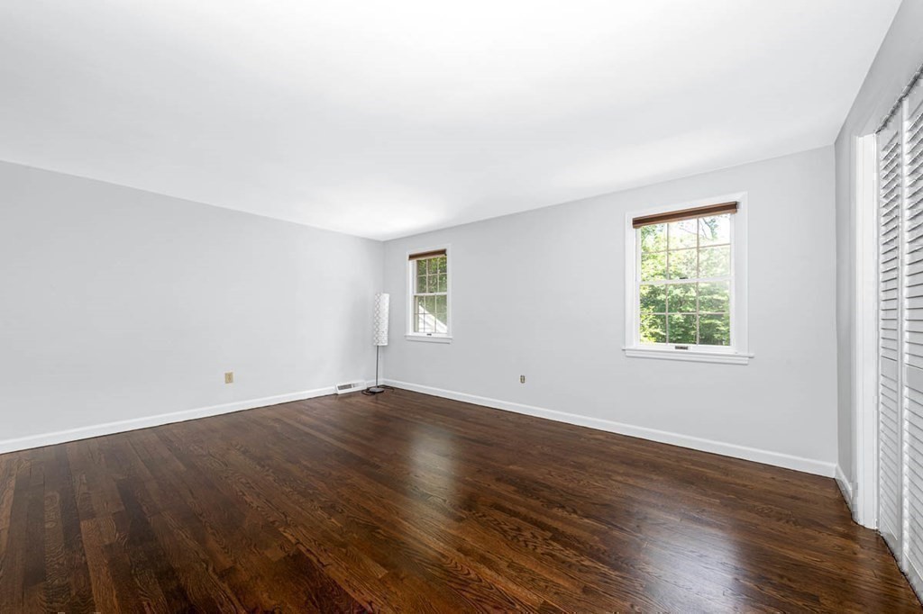 2 King George Drive Boxford, MA 01921 - Photo 38 of 41 an empty room with wooden floor and windows