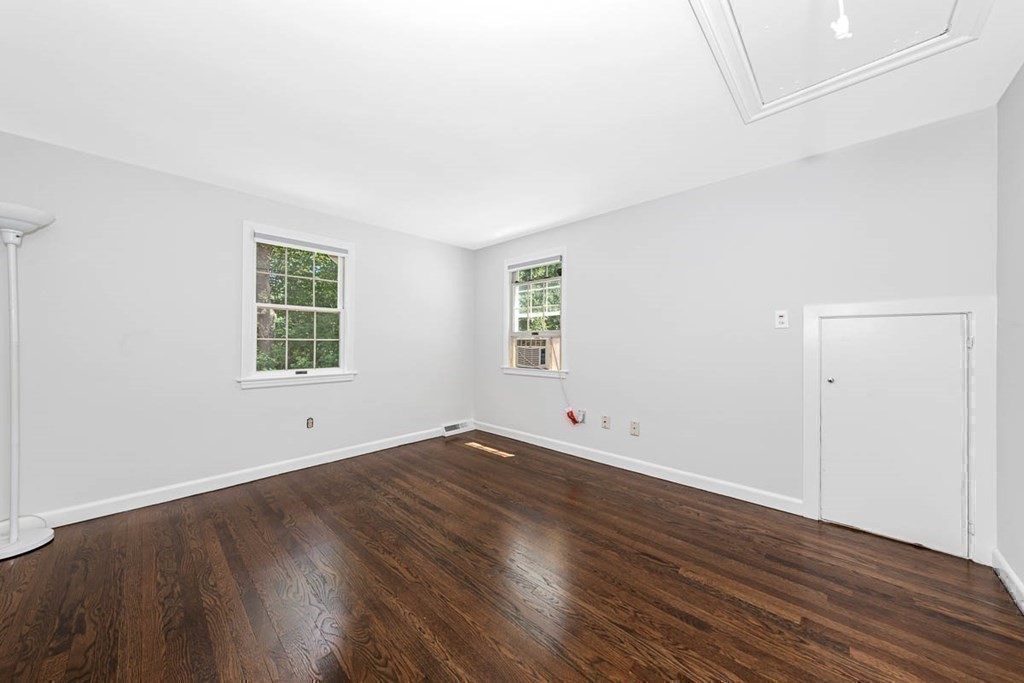 2 King George Drive Boxford, MA 01921 - Photo 40 of 41 an empty room with wooden floor and windows