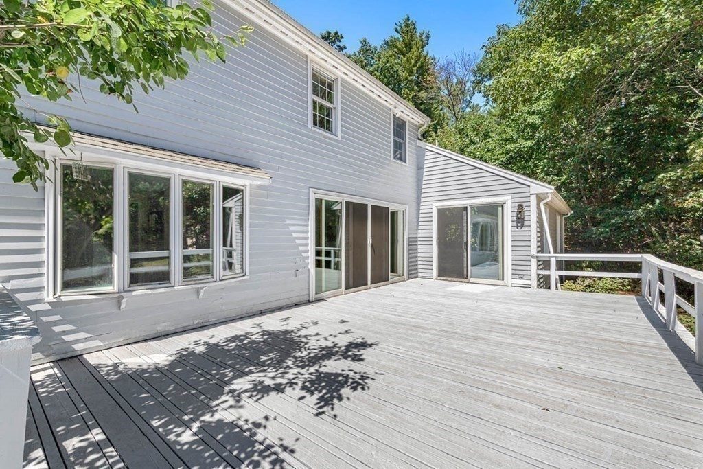 2 King George Drive Boxford, MA 01921 - Photo 7 of 41 a view of a house with a wooden deck