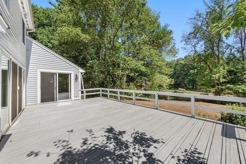 2 King George Drive Boxford, MA 01921 - Photo 9 of 41 a view of a roof deck with couches and wooden floor