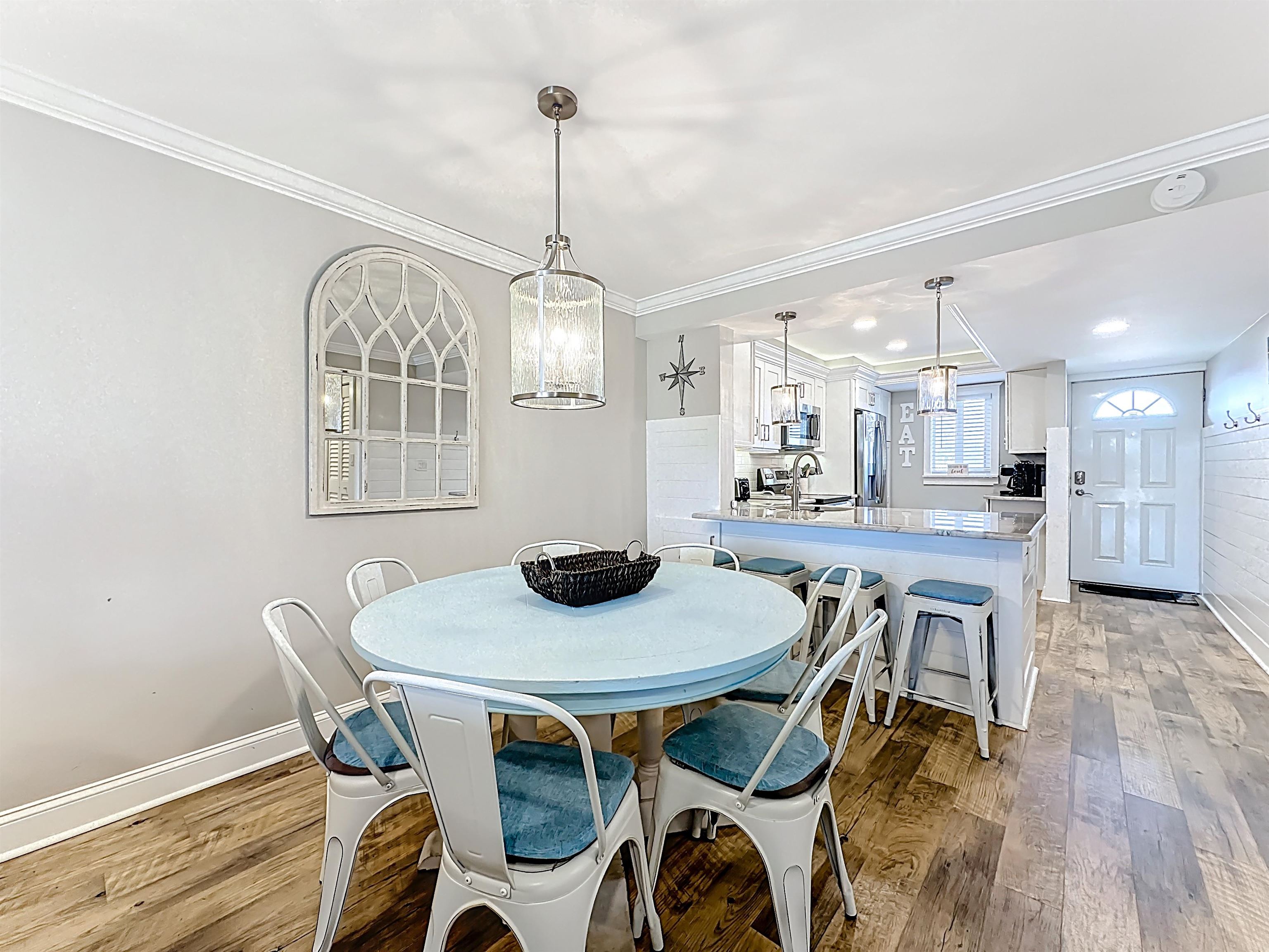 4 Ocean Trace Road, Unit 213 St. Augustine, FL 32080 - Photo 12 of 38 a view of a dining room with furniture window and wooden floor