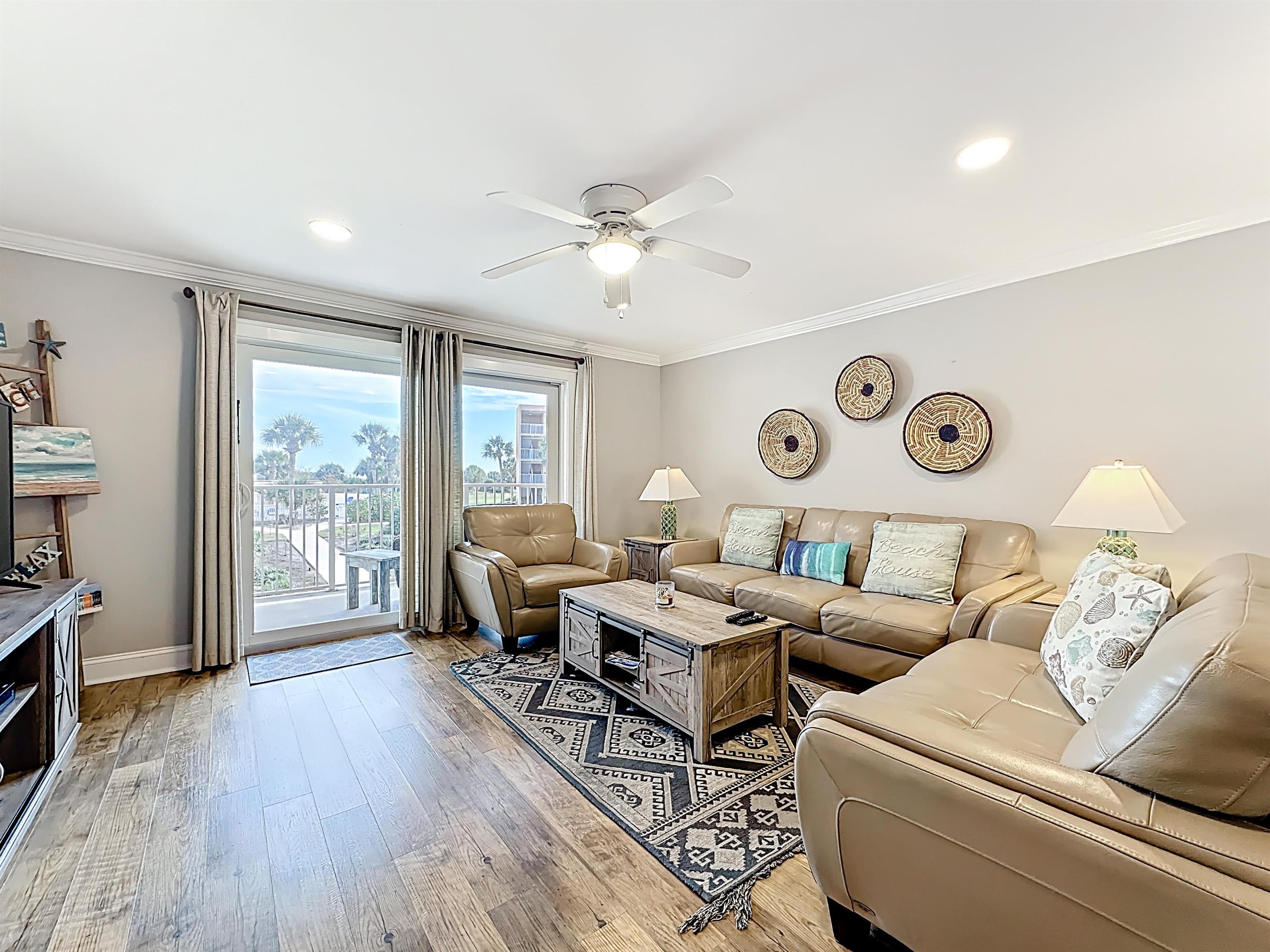 4 Ocean Trace Road, Unit 213 St. Augustine, FL 32080 - Photo 15 of 38 a living room with furniture and wooden floor