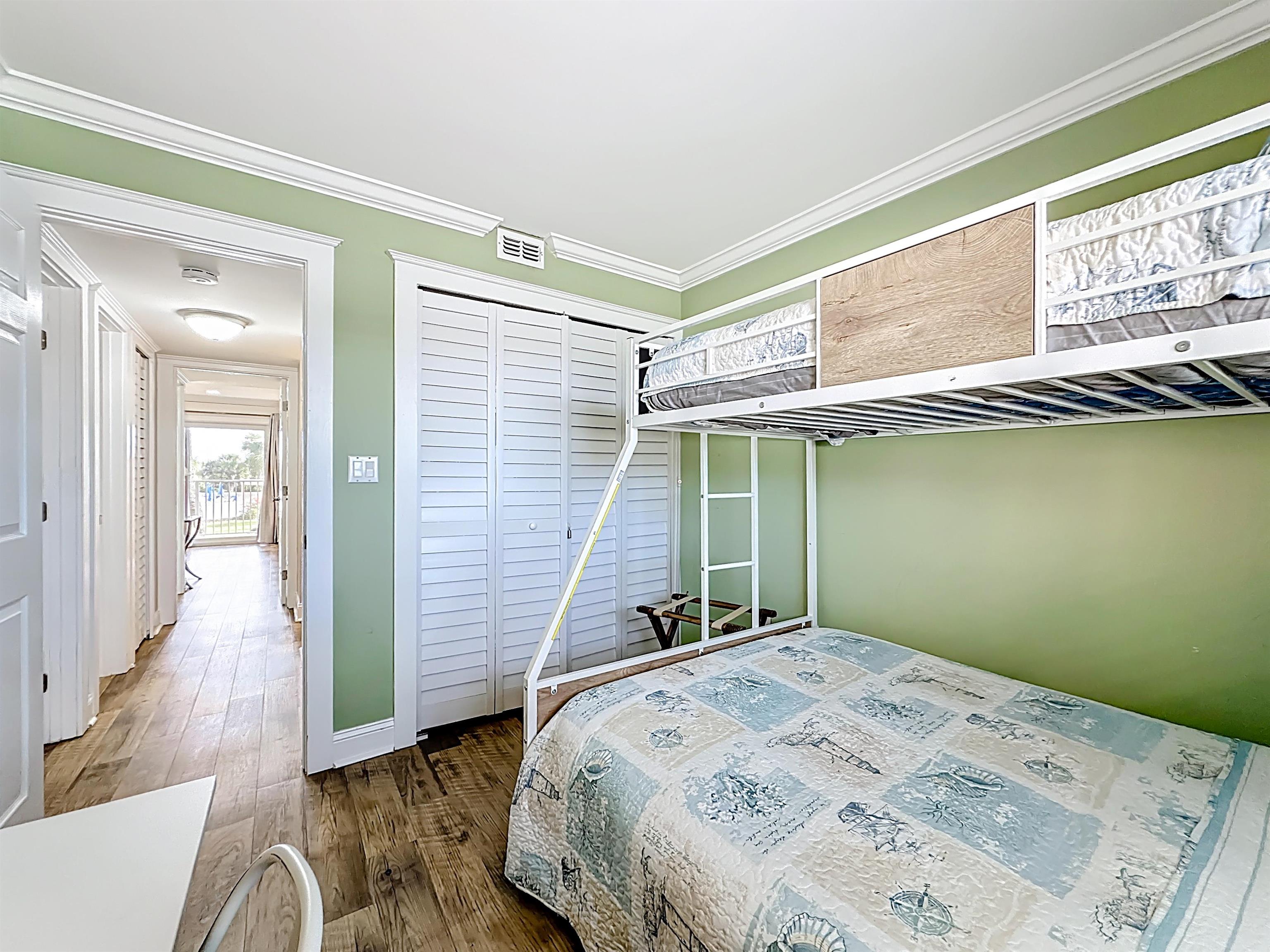 4 Ocean Trace Road, Unit 213 St. Augustine, FL 32080 - Photo 18 of 38 a bedroom with a bed and a window