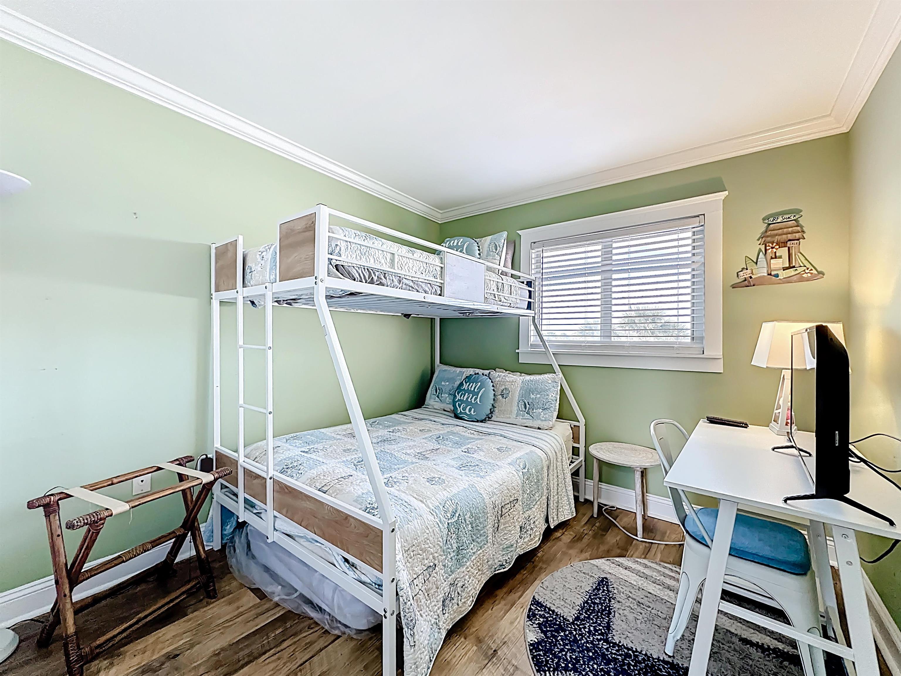 4 Ocean Trace Road, Unit 213 St. Augustine, FL 32080 - Photo 19 of 38 a bedroom with a bed and a window