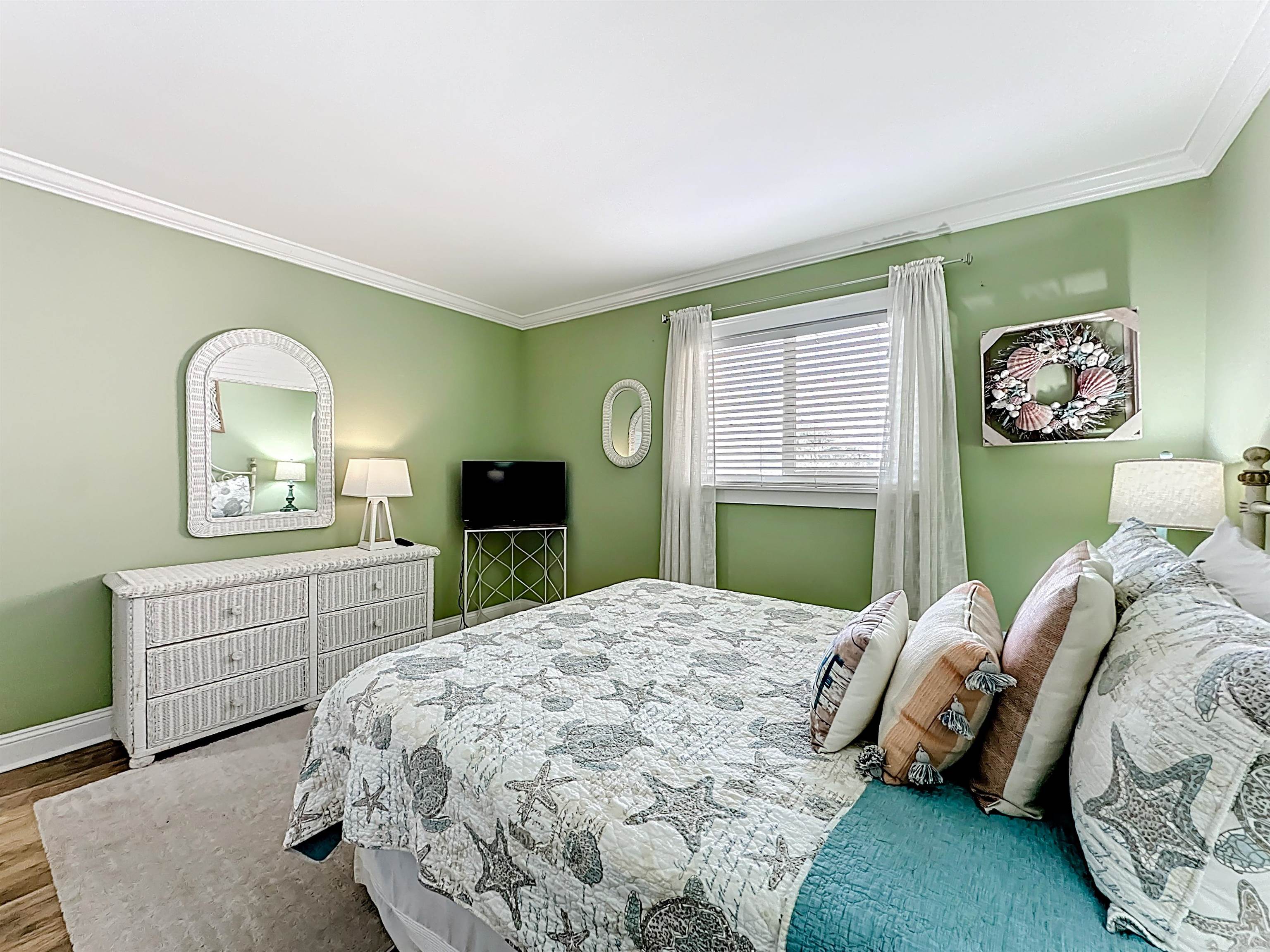 4 Ocean Trace Road, Unit 213 St. Augustine, FL 32080 - Photo 20 of 38 a bedroom with a bed and a dresser