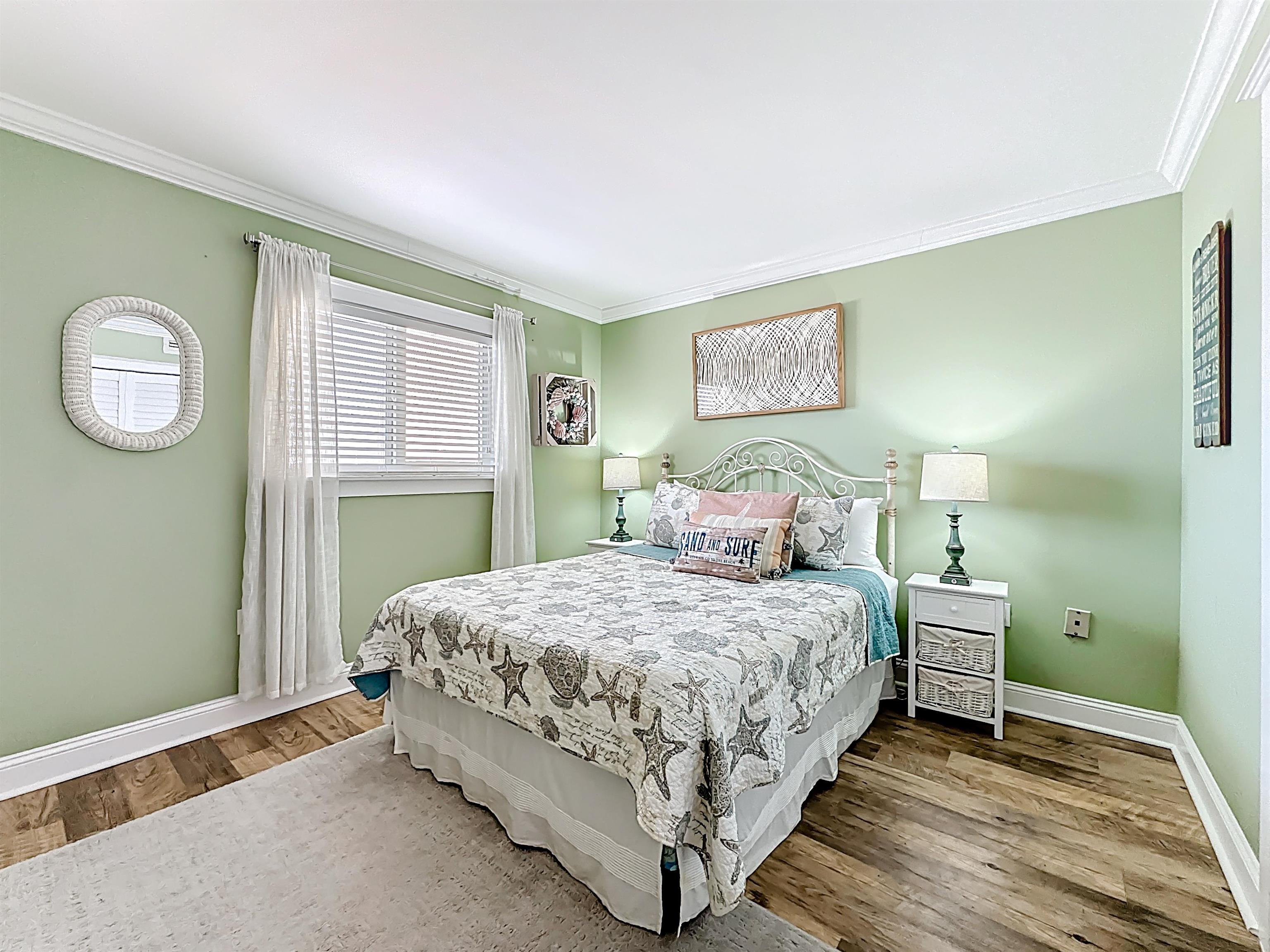 4 Ocean Trace Road, Unit 213 St. Augustine, FL 32080 - Photo 21 of 38 a bedroom with a bed and a table